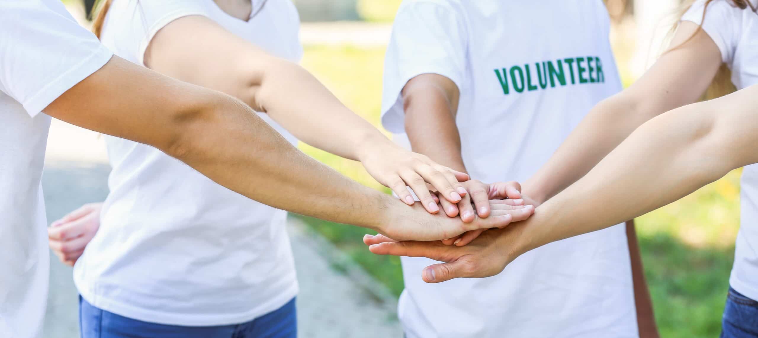 Group,Of,Volunteers,Stacking,Hands,Outdoors,,Community,Charity,Teamwork,And Nonprofit Insurance Pennsylvania